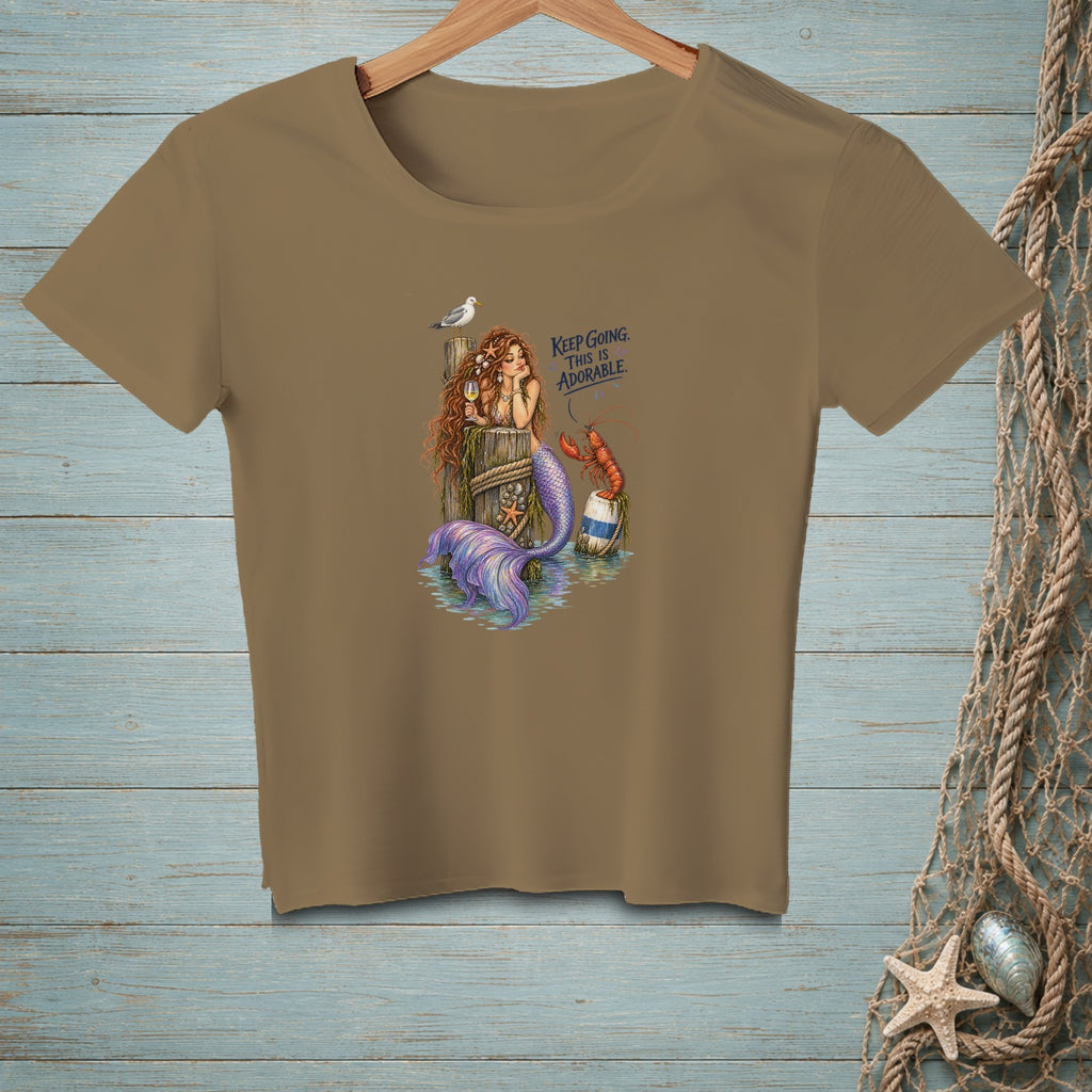 Mermaid on dock with lobster, text "KEEP GOING. THIS IS ADORABLE."