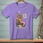 Purple t-shirt with a mermaid illustration and "Don't Judge My Current Situation" text.