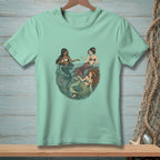 Mint t-shirt with illustration of three mermaids in a circular underwater scene.