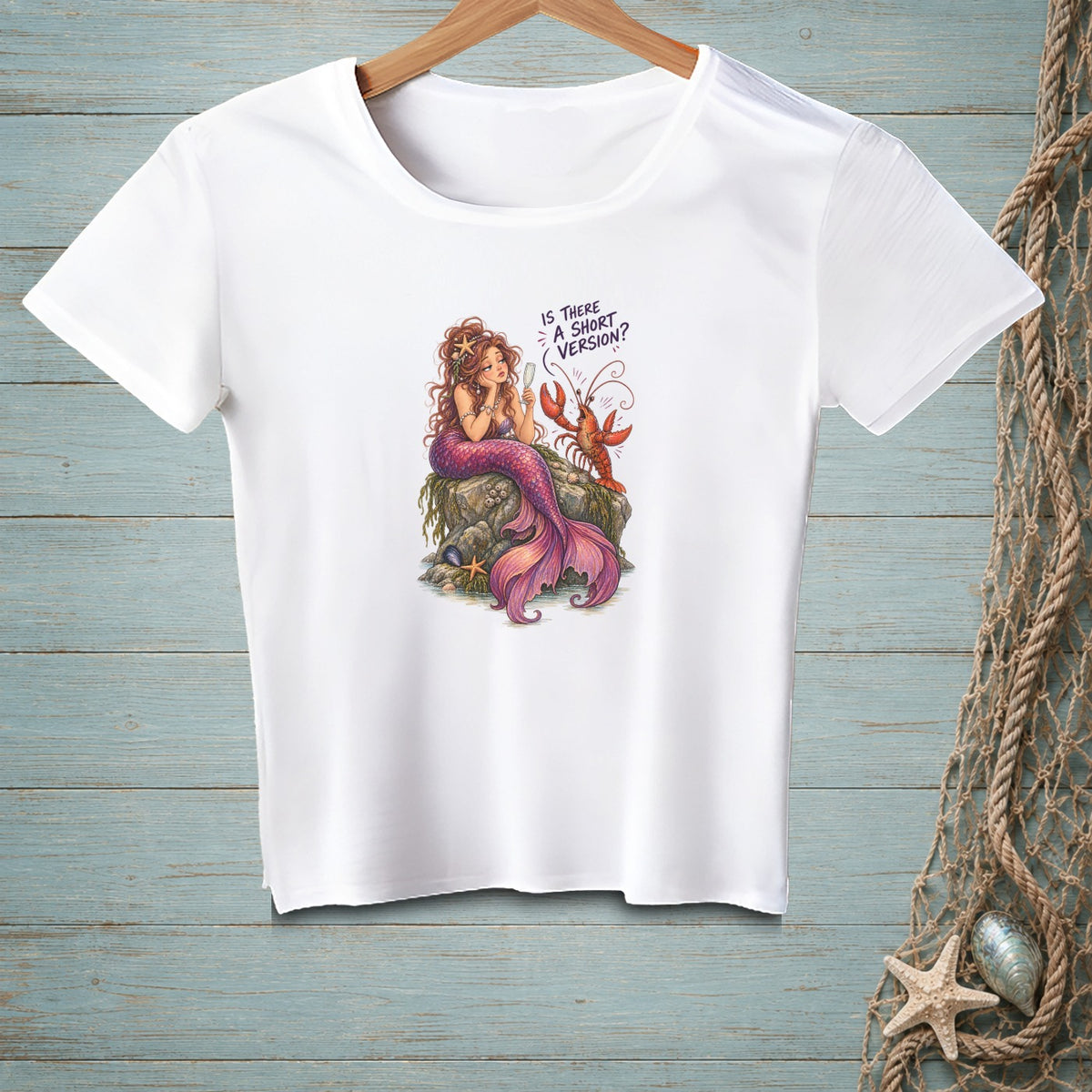 White t-shirt with a mermaid and lobster illustration reading "Is there a short version?".