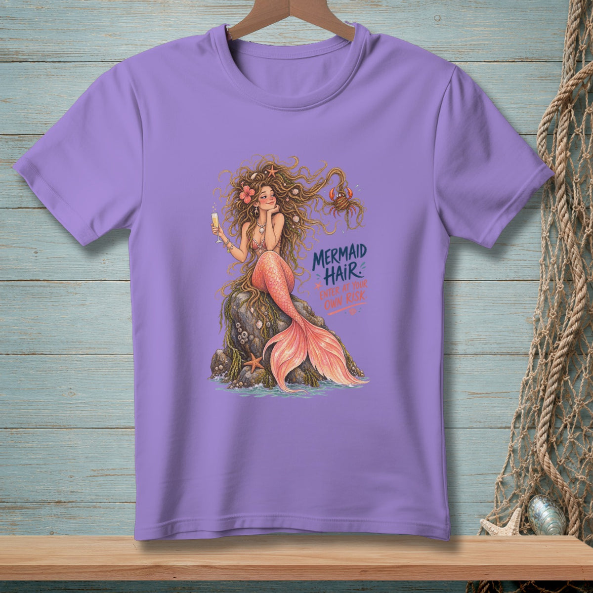 Lavender t-shirt with a mermaid illustration and the text "MERMAID HAIR ENTER AT YOUR OWN RISK".