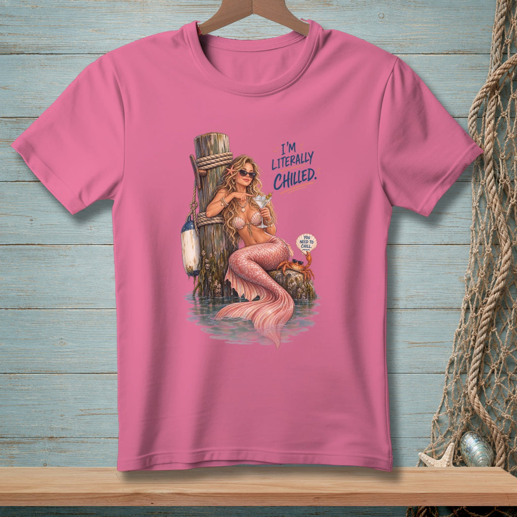 Pink t-shirt with a mermaid on a dock, holding a drink, with text "I'M LITERALLY CHILLED."