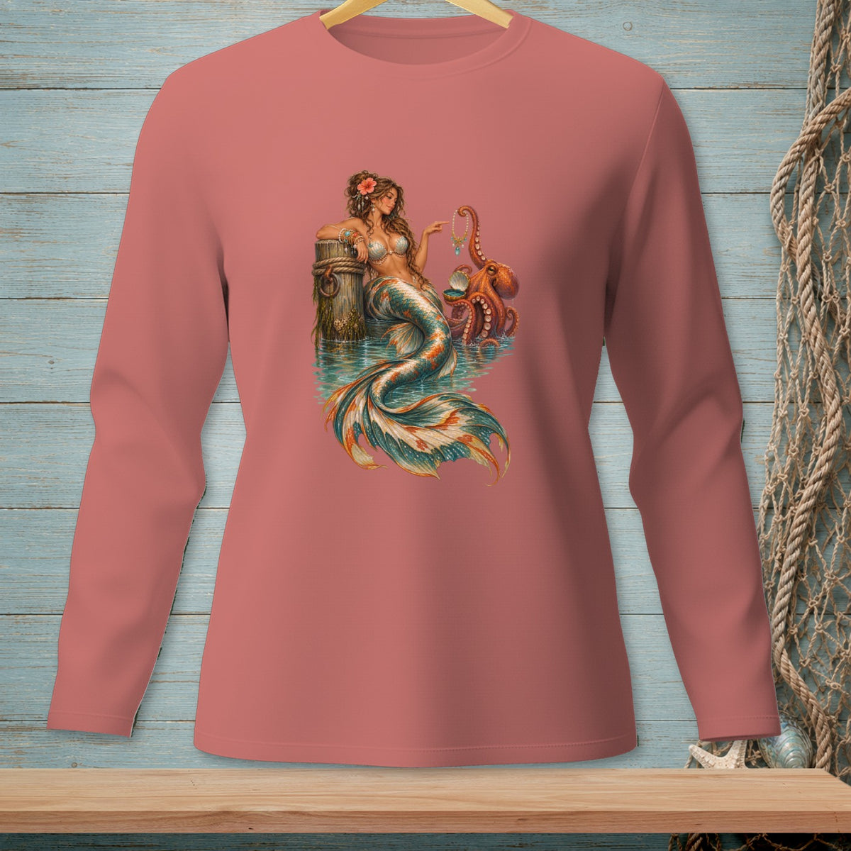 Mermaid with octopus holding a necklace by a weathered post in the water.