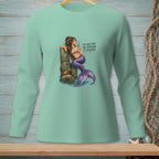 Mermaid with purple tail drinks martini beside a wooden post, text reads "I'll give that the attention it deserves."