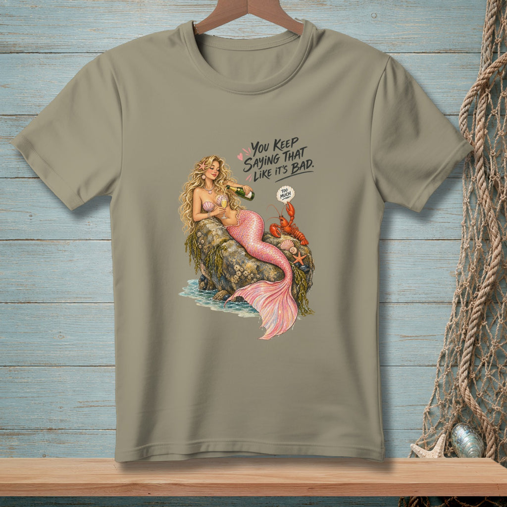 Mermaid with champagne bottle and lobster on rock, text says "You keep saying that like it's bad."