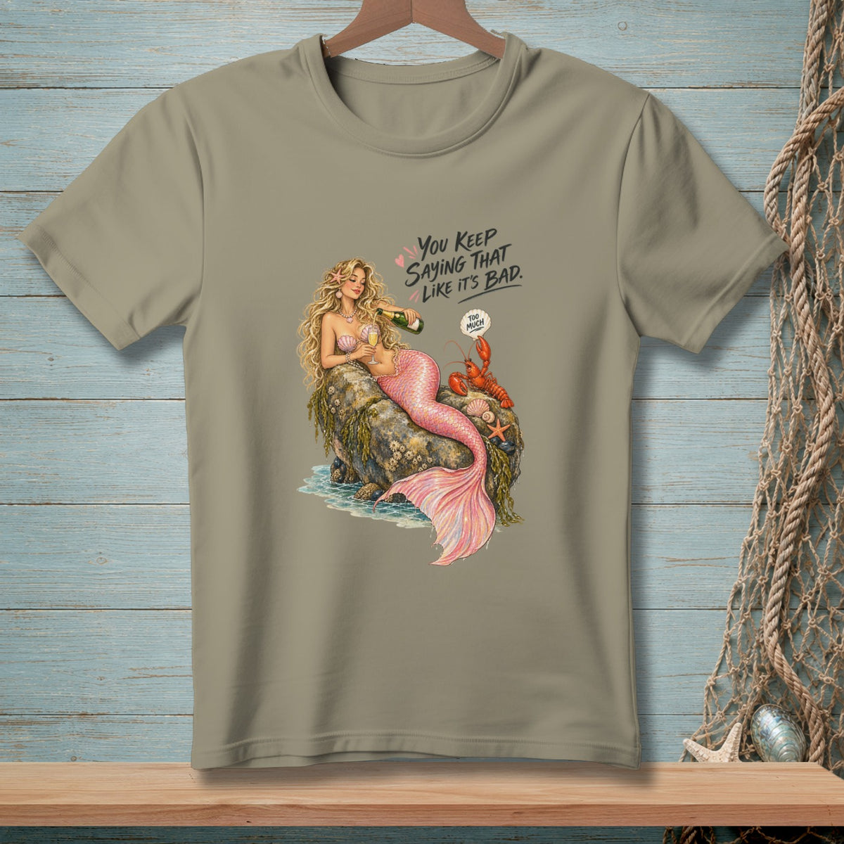 Mermaid with champagne bottle and lobster on rock, text says "You keep saying that like it's bad."
