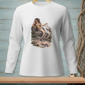 White long-sleeve shirt with a mermaid sitting on rocks by the ocean.