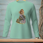 Mint long-sleeve shirt with a graphic of a mermaid sitting on rocks by the sea.
