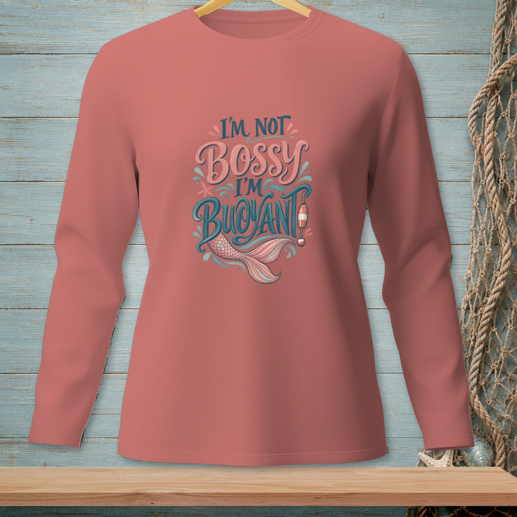 Salmon long-sleeve shirt with "I'm Not Bossy I'm Buoyant" text and mermaid tail graphic.