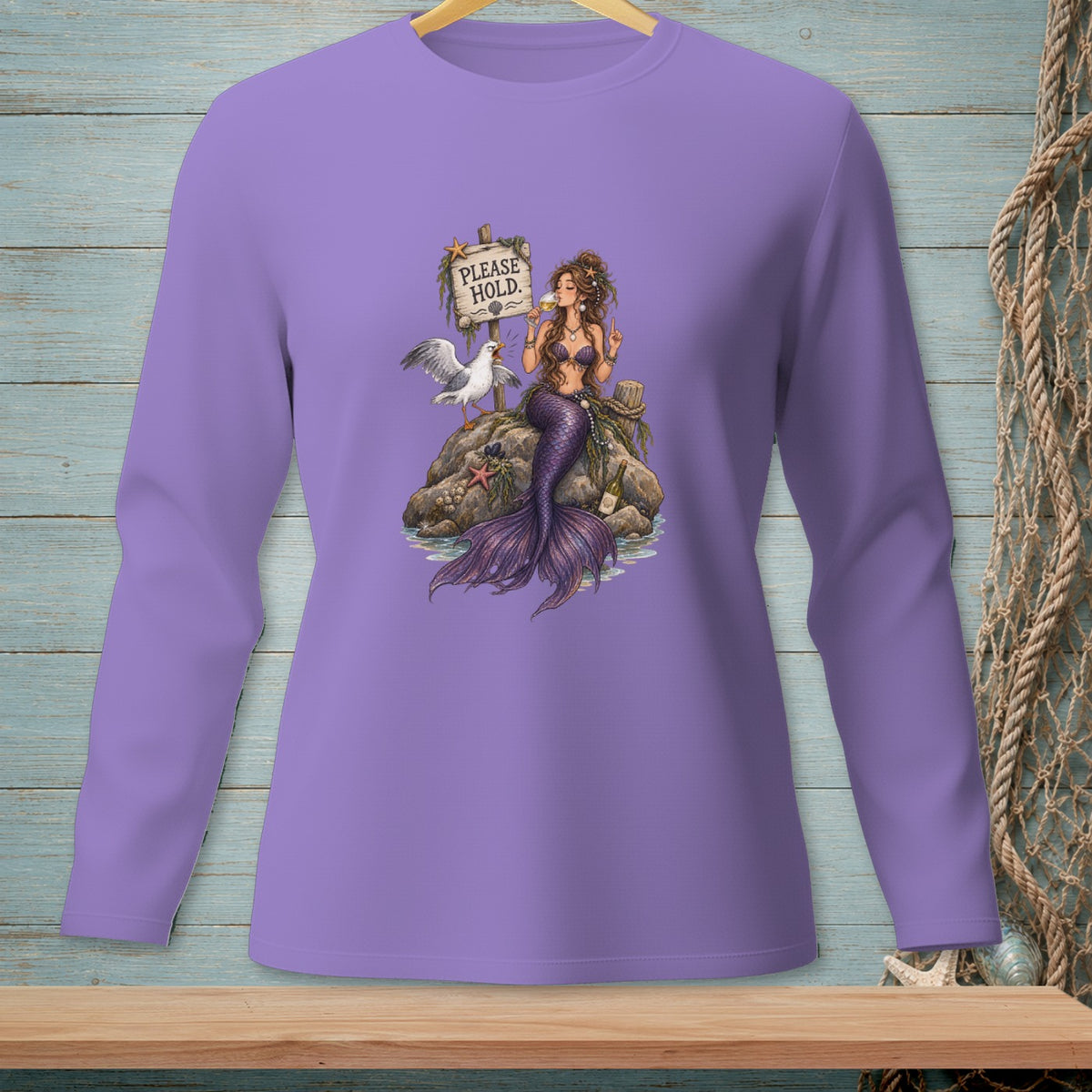 Mermaid with purple tail and drink sits on rock with seagull and "Please Hold" sign.