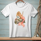 White t-shirt with a drawing of a mermaid holding a martini, resting on a rock with "Aim High" on a shell.