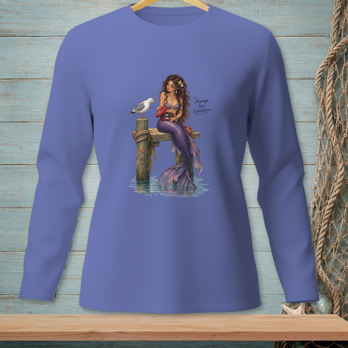 Mermaid with a seagull and crab on a dock, with text "Manage Your Expectations."
