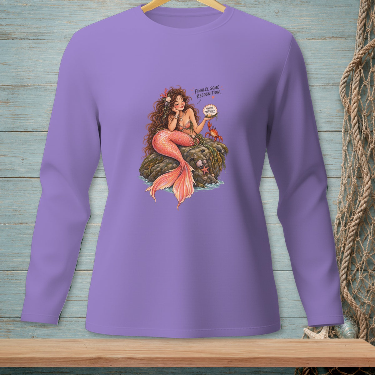 Mermaid with crab on rock, text "Finally, some recognition. You're difficult."