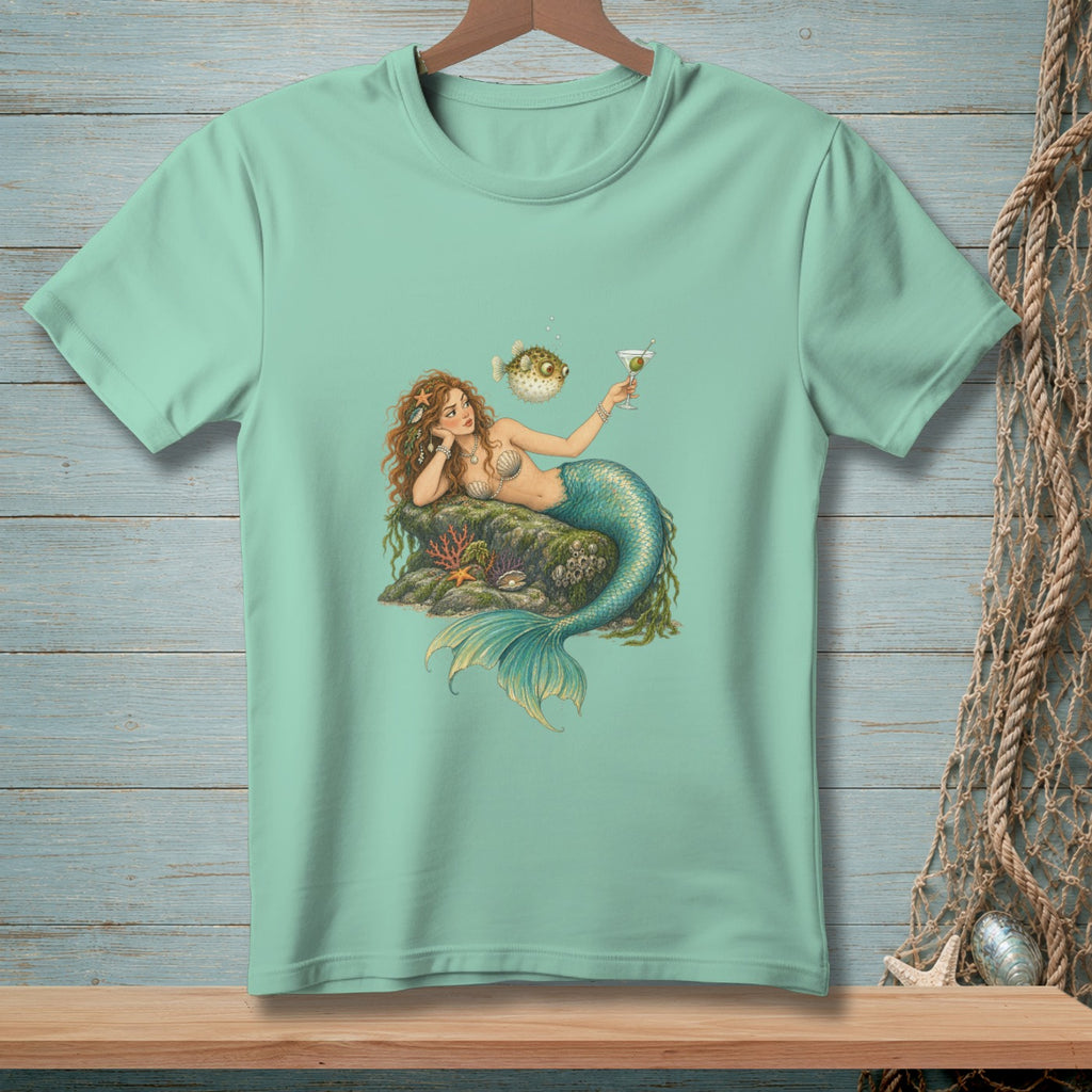 Mermaid with drink and pufferfish on a rock with coral.