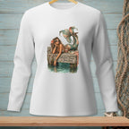 Long sleeve white shirt with mermaid on a dock graphic saying "Whatever Floats Your Boat".