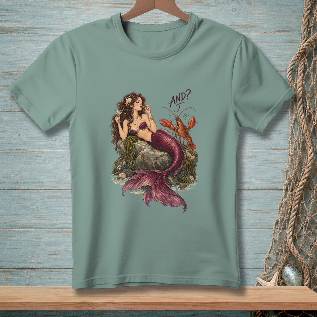 Mermaid with lobster on a rock, holding a drink, text "AND?".