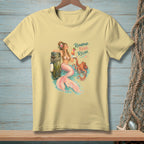 Yellow t-shirt graphic of a mermaid with an octopus and text: Repurpose. Reuse. Relax.