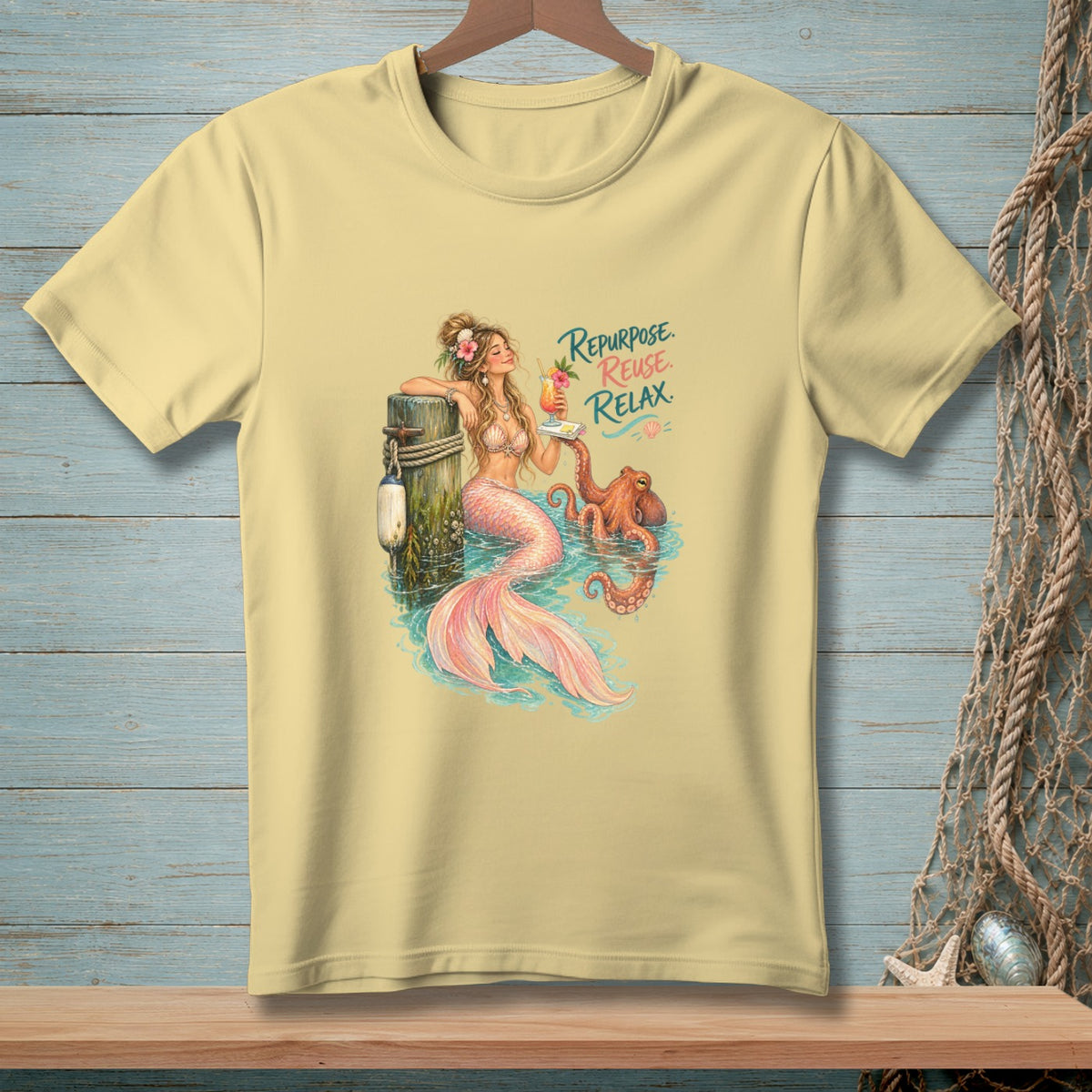Yellow t-shirt graphic of a mermaid with an octopus and text: Repurpose. Reuse. Relax.