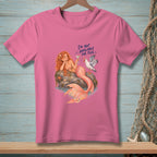 Pink t-shirt with mermaid and seagull graphic reading "I'm not available for this."