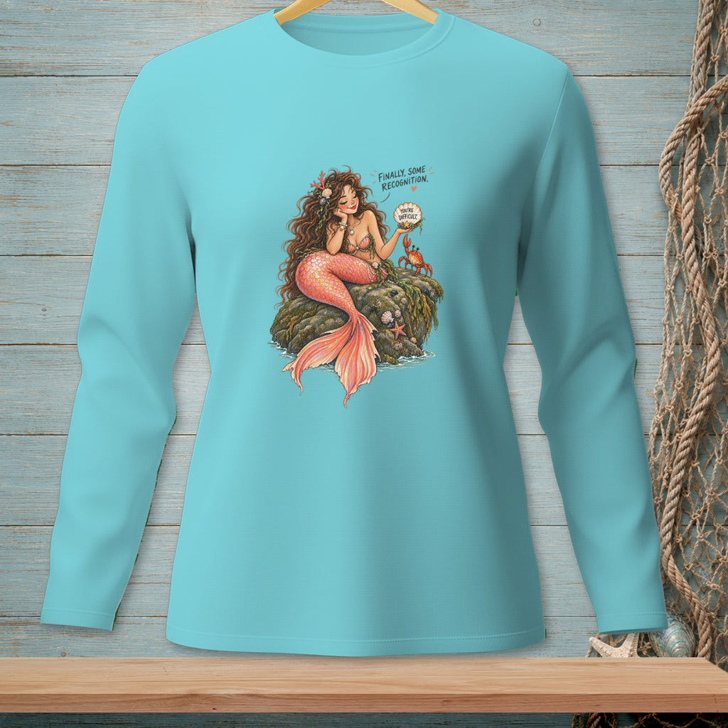 Teal long sleeve shirt with a mermaid illustration and speech bubbles.