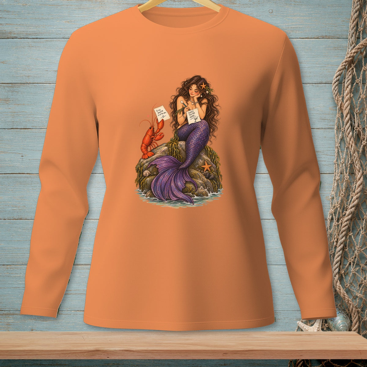 Mermaid with lobster and starfish on rock, holding papers with text.