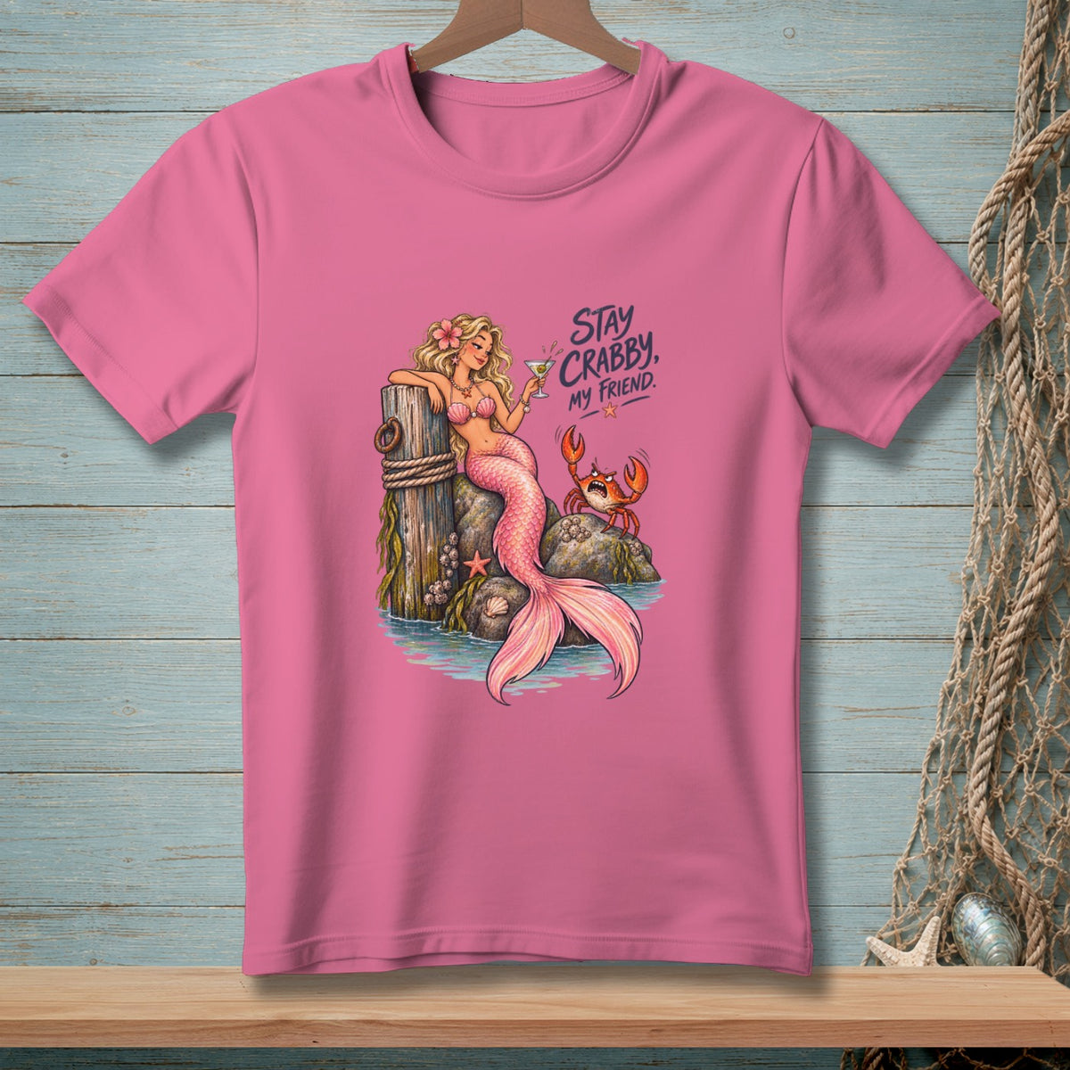 Pink t-shirt with mermaid and crab graphic that reads "Stay Crabby, My Friend."
