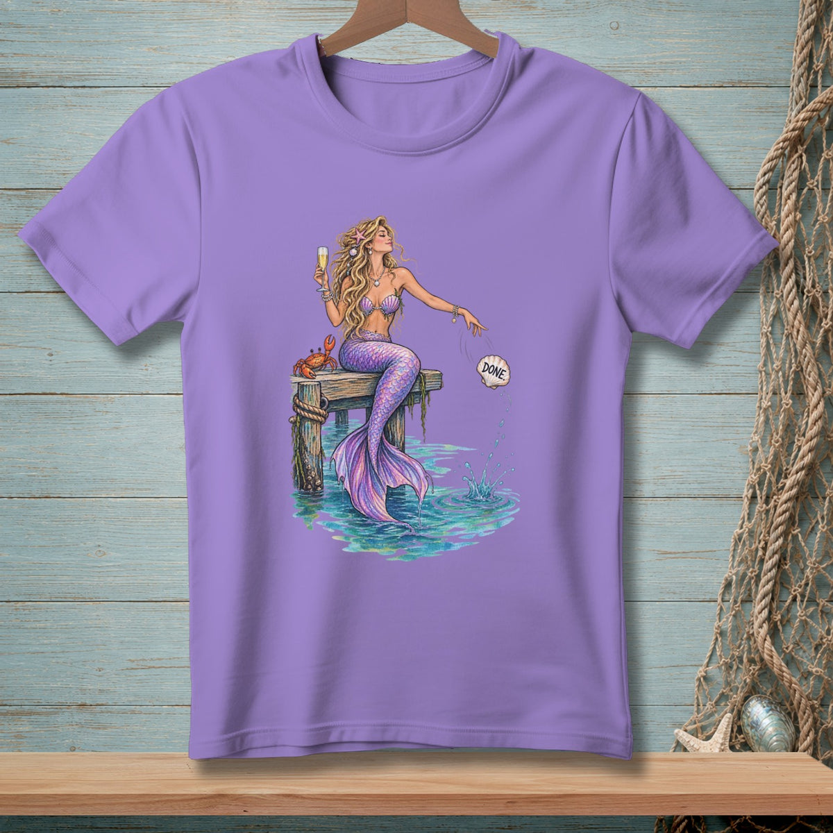 Mermaid with champagne and crab on a dock, throwing shell labeled "Done".