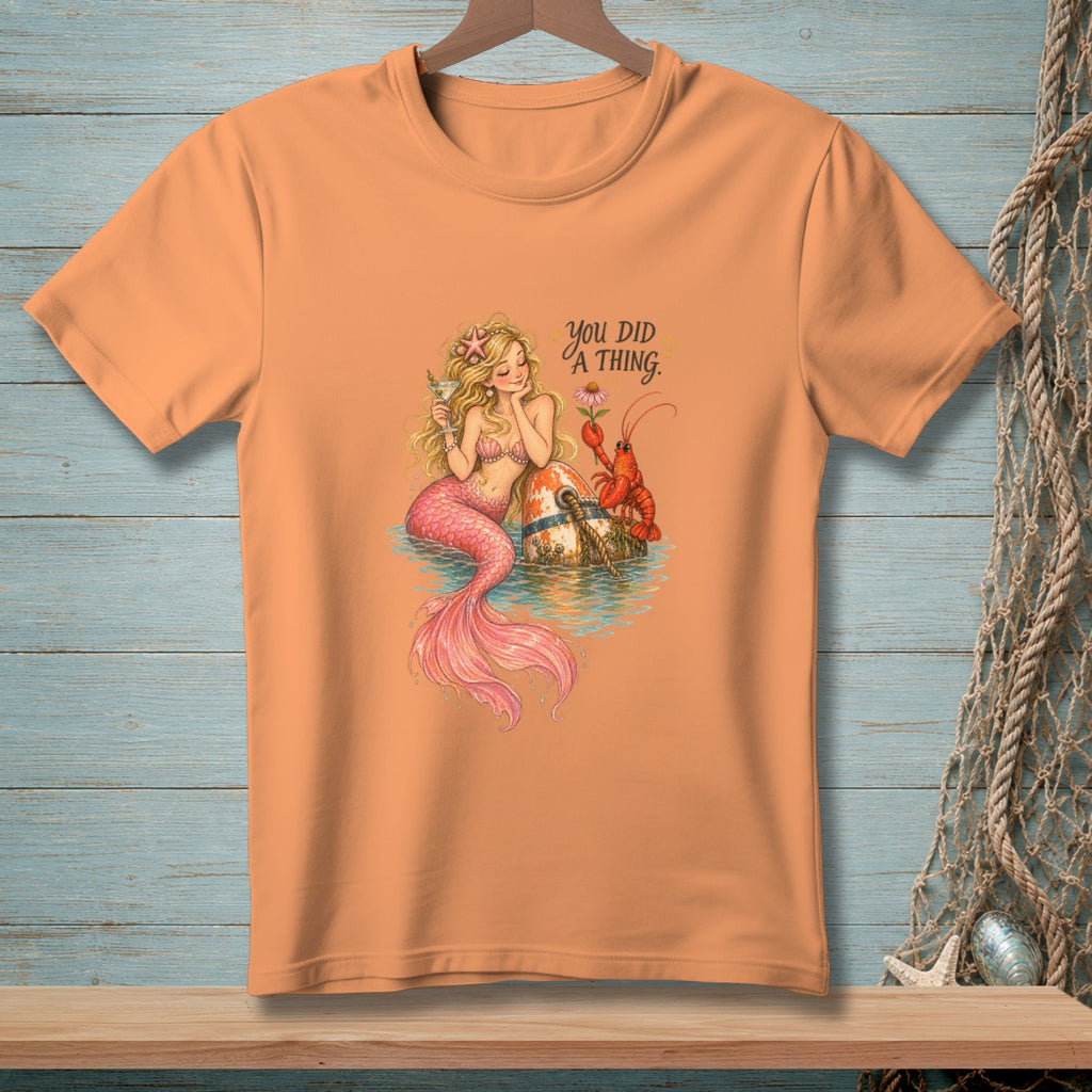 Orange t-shirt with a mermaid, lobster, and text "You DID A THING."