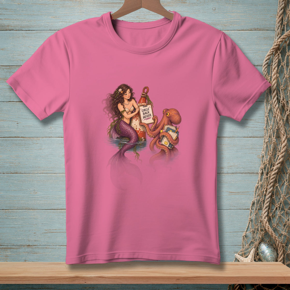Illustration of a mermaid and octopus on a pink t-shirt with text "CIRCLE BACK NEVER".