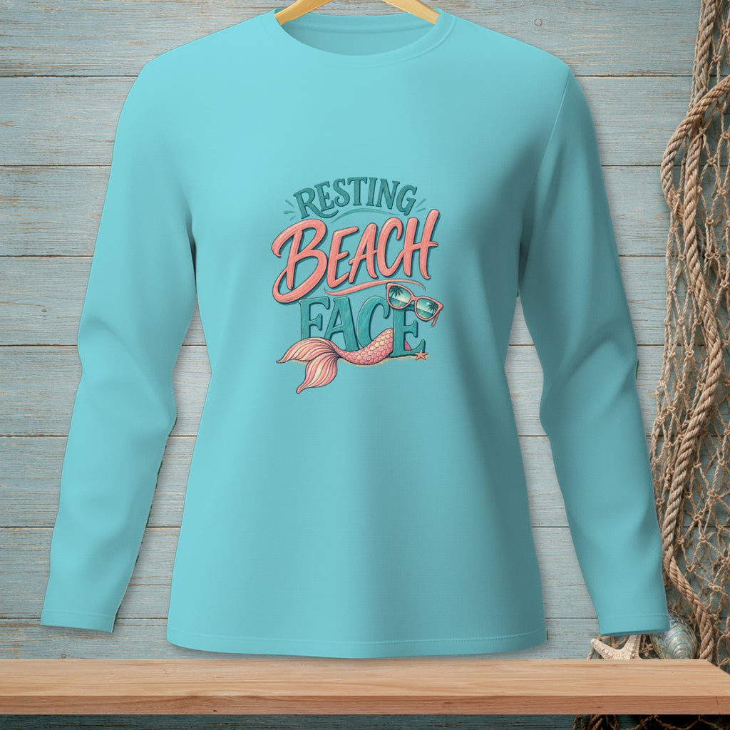Teal long-sleeve shirt with "Resting Beach Face" text and mermaid tail graphic.