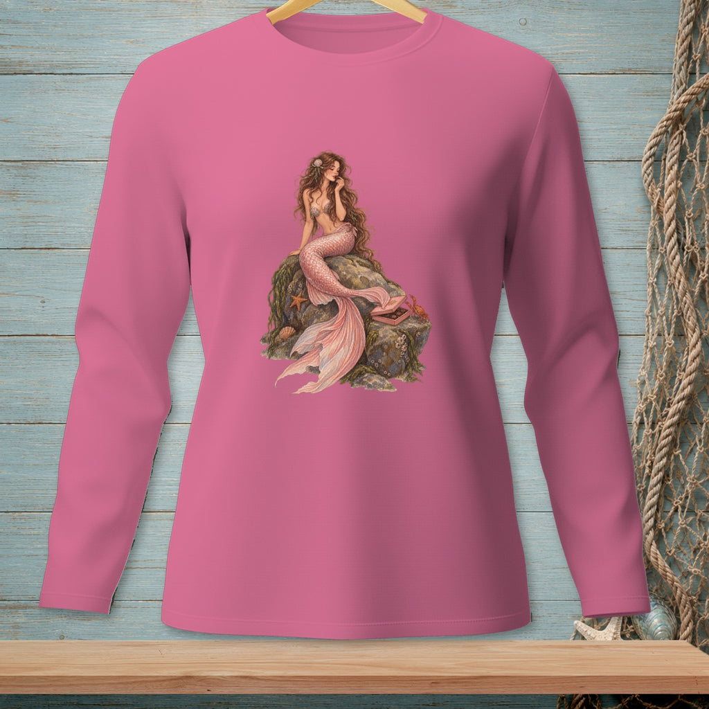 Pink long-sleeve shirt with a detailed illustration of a mermaid sitting on a rock.
