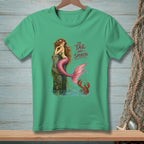 Green t-shirt featuring a mermaid on a post and text "The Tail Has Spoken."