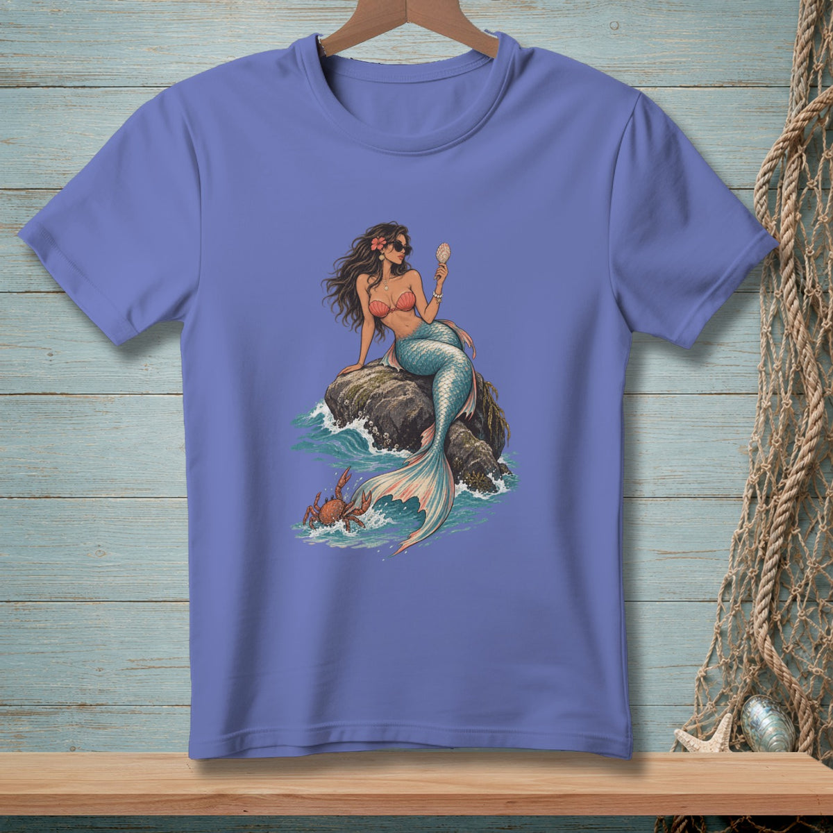 Mermaid holding a seashell sits on a rock with a crab and waves.