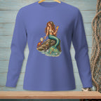 Mermaid sitting on a rock with a drink and a crab nearby, on a blue shirt.