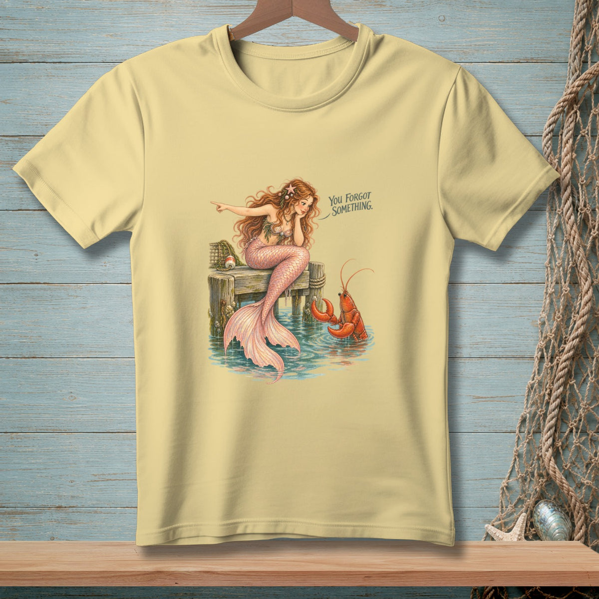Mermaid pointing at lobster with text "You Forgot Something."