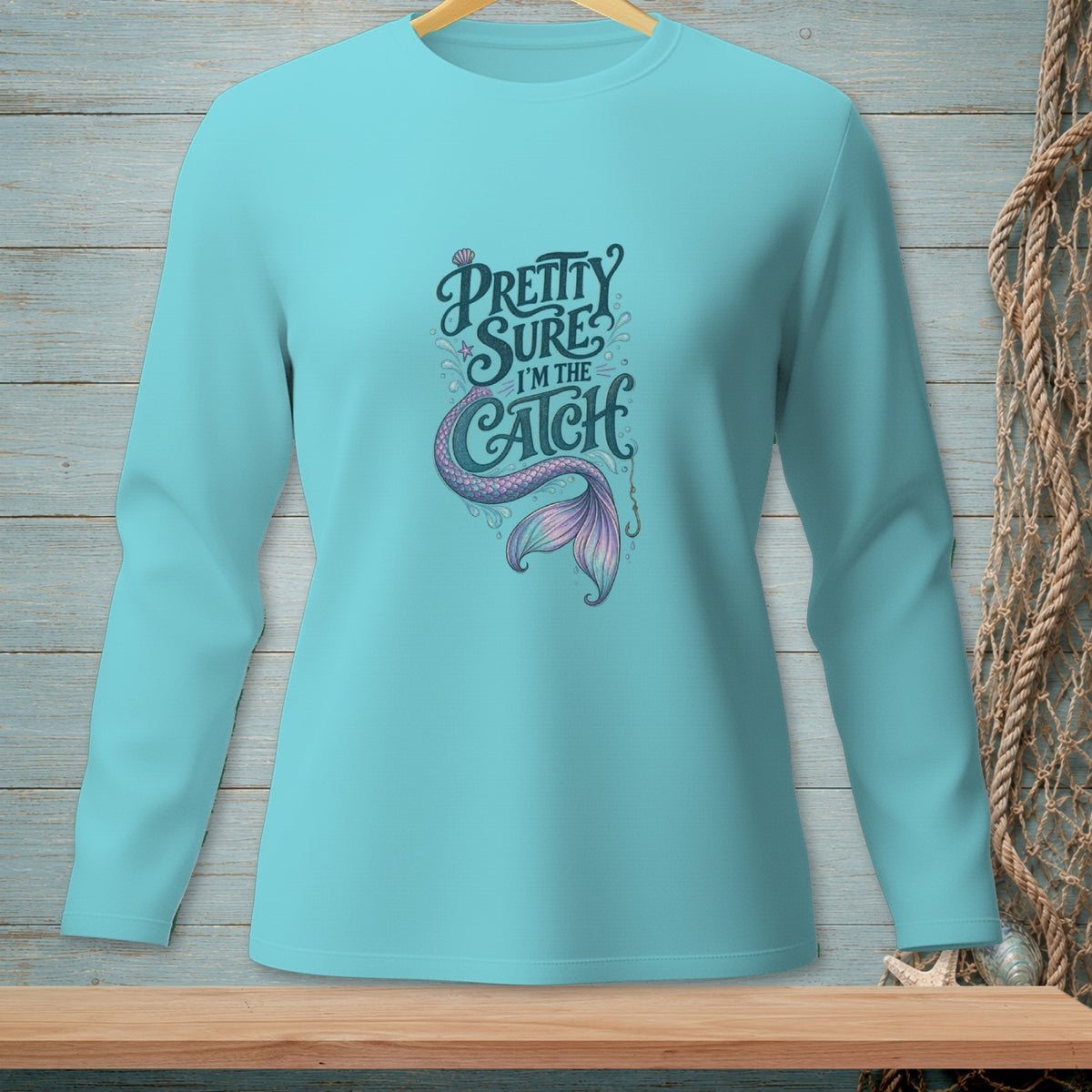 Aqua long sleeve shirt with mermaid tail and text "Pretty Sure I'm The Catch".