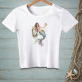 White t-shirt featuring a watercolor mermaid holding a pufferfish and resting on a buoy that reads "Good Vibes Only".