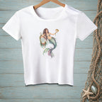 White t-shirt featuring a watercolor mermaid holding a pufferfish and resting on a buoy that reads "Good Vibes Only".