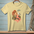 Light yellow t-shirt with a mermaid and seagull graphic that says "ARE YOU FINISHED?".