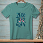 Teal t-shirt with "ZERO FINS GIVEN" text and pink mermaid tail graphic.