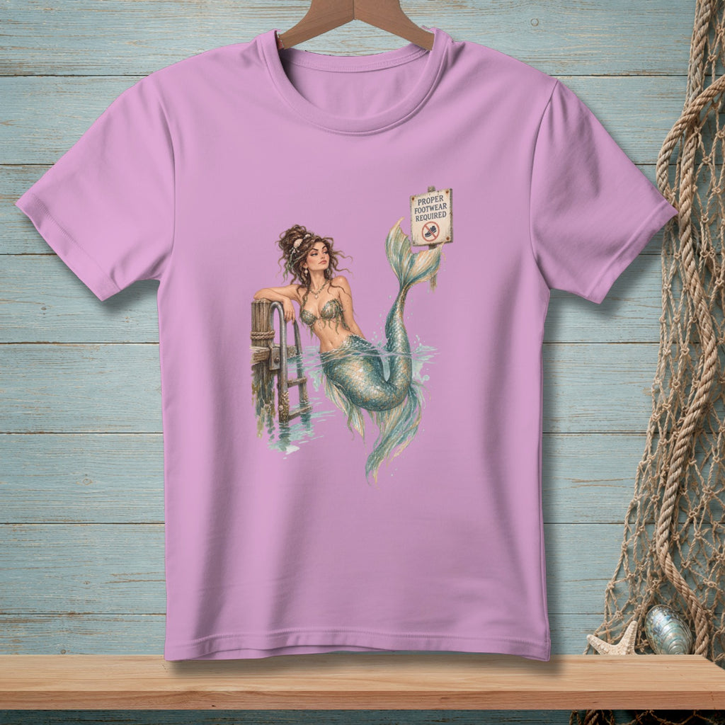 Purple t-shirt featuring a mermaid by a pier with a "Proper Footwear Required" sign.