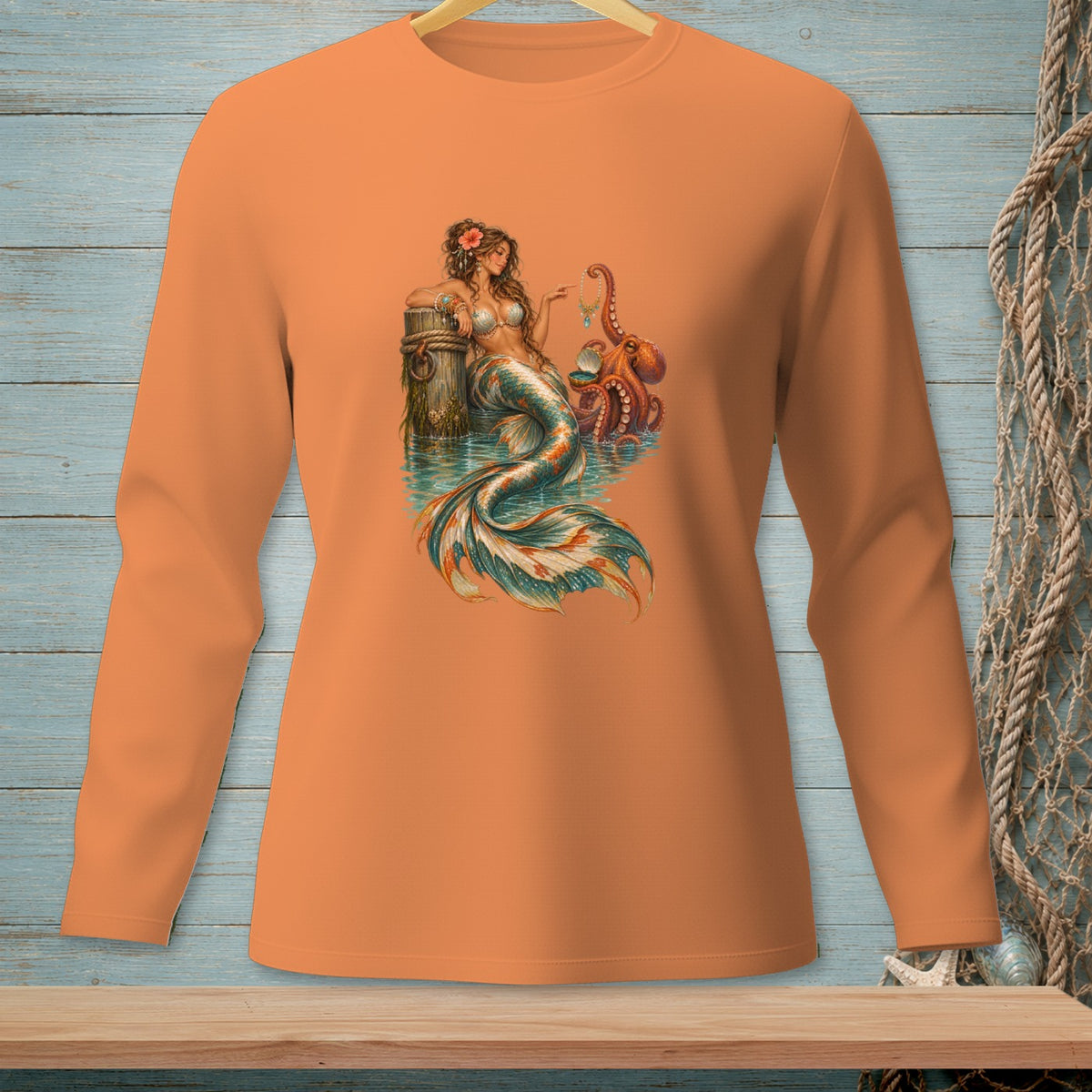 Mermaid and octopus art print on an orange long-sleeve shirt.