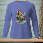 Illustration of a mermaid holding wine, sharing food with a seagull on a rock.