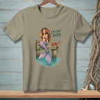 Mermaid with drink and crab on dock, text "I'M OFF DUTY."