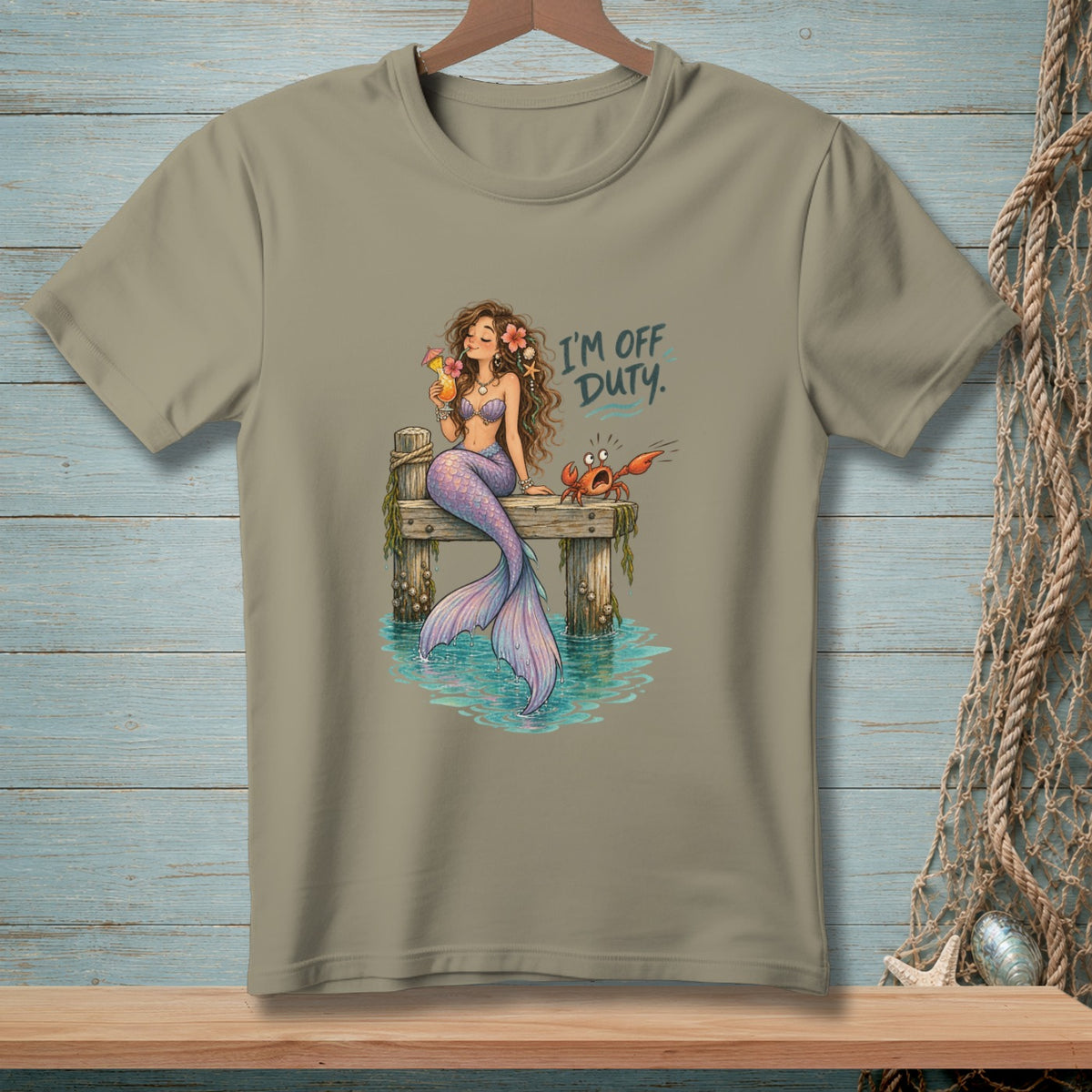 Mermaid with drink and crab on dock, text "I'M OFF DUTY."
