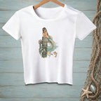 White t-shirt with illustration of a mermaid sitting on a dock with fish and a goldfish.