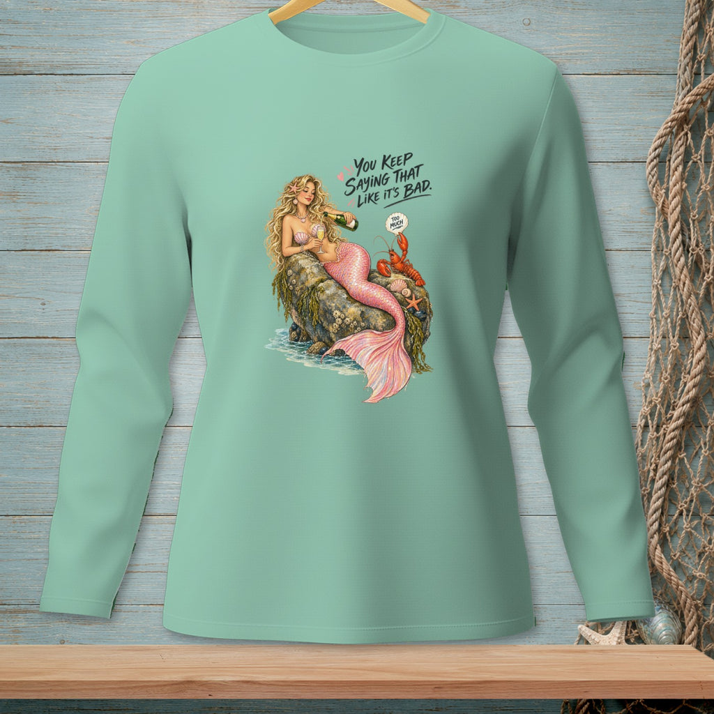 Mermaid with lobster and champagne on rock, text reads "You keep saying that like it's bad. Too much."