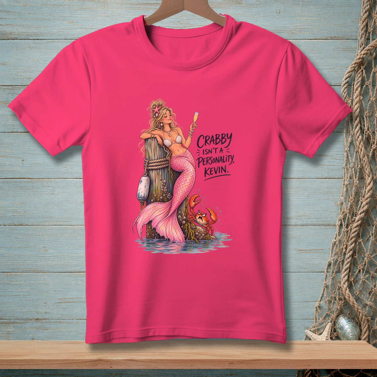 Pink t-shirt with mermaid, crab, and text "Crabby Isn't A Personality, Kevin."