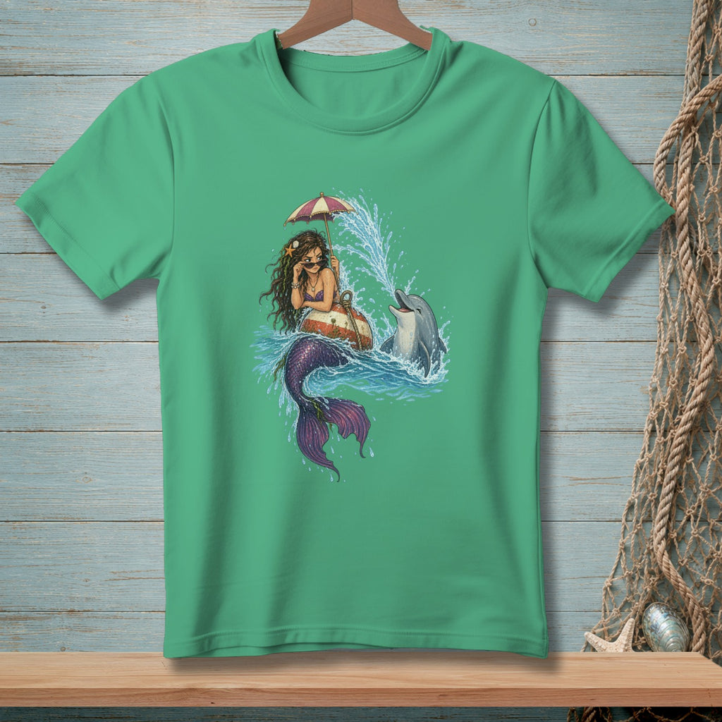 Mermaid holding umbrella with dolphin jumping in water on green t-shirt.