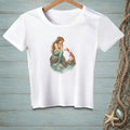 White t-shirt with mermaid and lobster artwork on a rock in water.